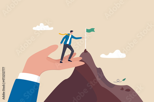 Helping hand, coaching or mentor support employee to achieve business target, inspiration or advantage to reach goal concept, businessman stand on giant helping hand to reach mountain peak target flag