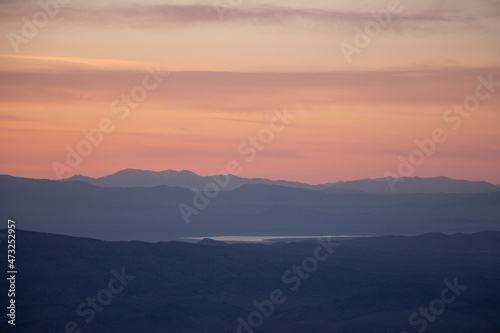 sunset over the west desert with the mountains of utah and Nevada in the distance