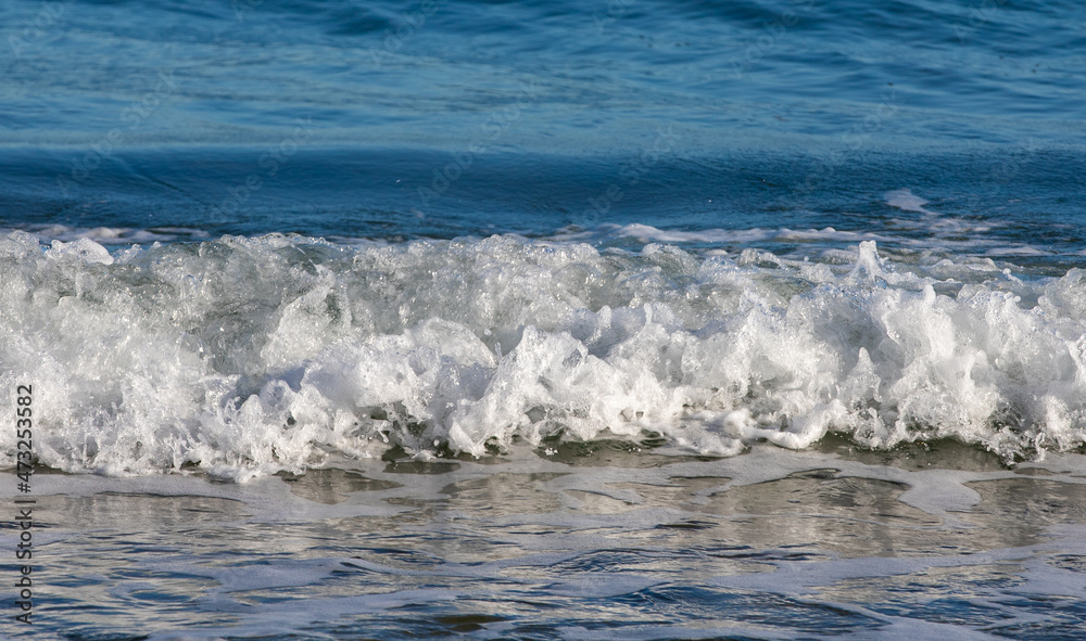 a small wave at the seashore