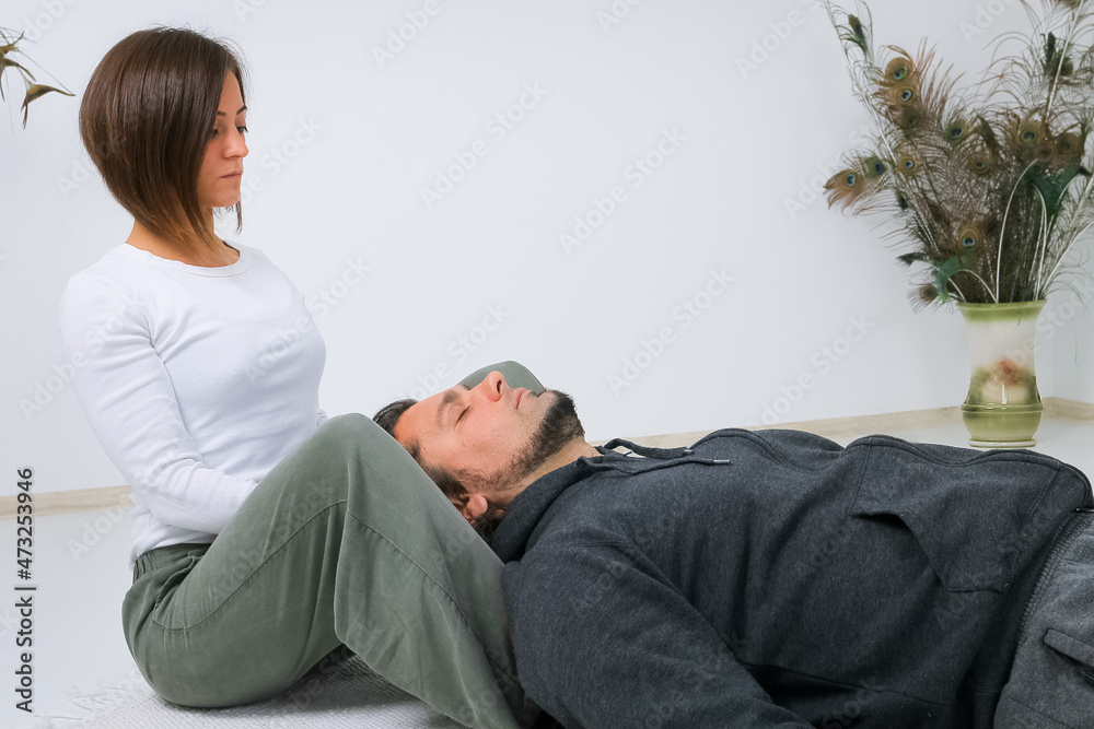 Man getting Shiatsu massage from Shiatsu masseuse Man getting Shiatsu massage from Shiatsu masseuse