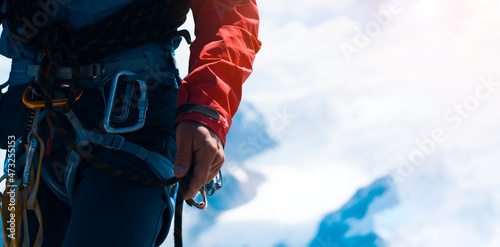 Man with climbing equipment, close up view.