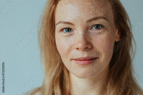 Fototapete Beautiful woman with read hair and freckles