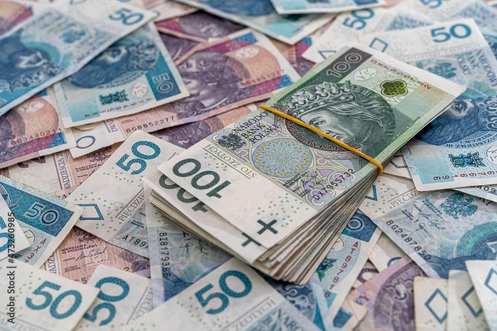 pile of polish banknotes zloty as financial background