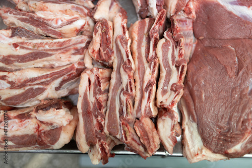 Meat sale on shopwindow at european butcher market counter.