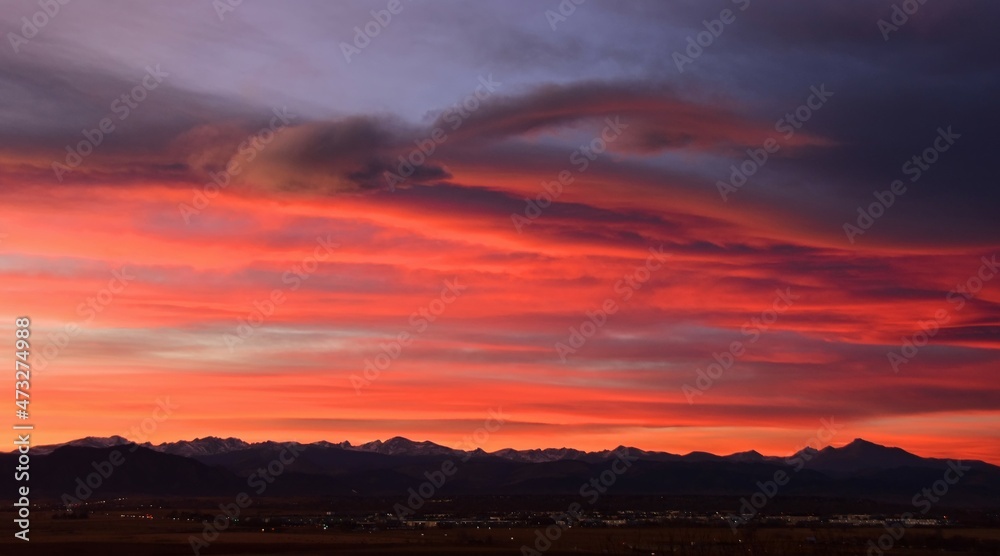 colorful sunset over long's peak and the front range of the colorado rocky mountains, as seen from broomfield,colorado colorful sunset over long's peak and the front range of the colorado rocky mountains, as seen from broomfield,colorado