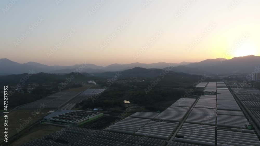 Vegetable greenhouse and mountain village during sunset Vegetable greenhouse and mountain village during sunset