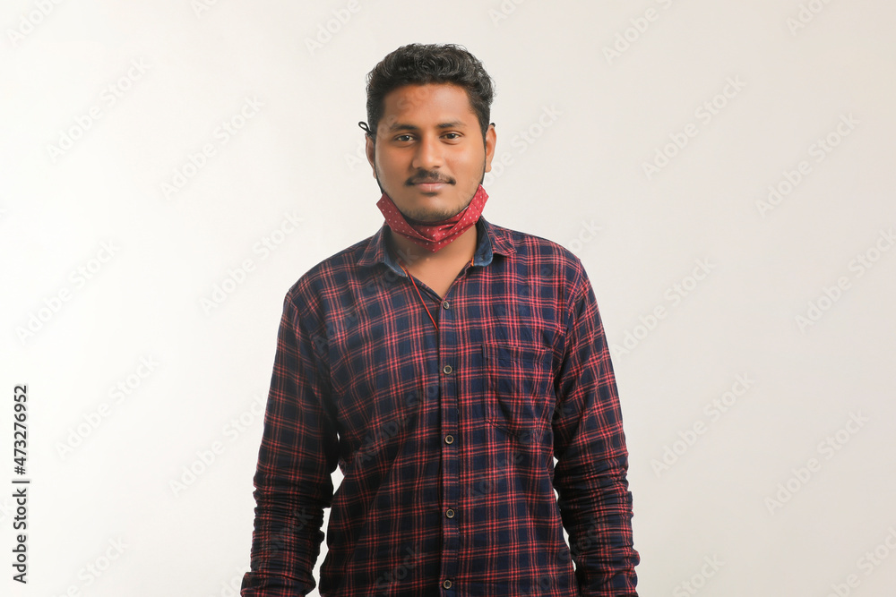 Obraz premium Young indian man giving expression with hand over white background.