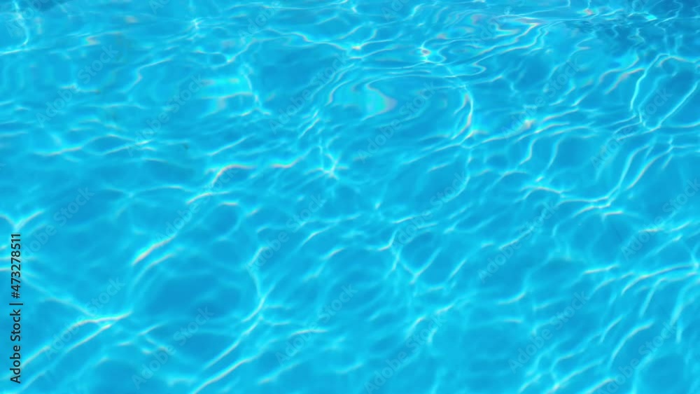 Water drop in swimming pool. Blue color. Ocean lockdown surface. Stop motion video. H2O hotel relax. Sea summer texture. Crystal wet waves. Float calm splash. Nobody liquid background Water drop in swimming pool. Blue color. Ocean lockdown surface. Stop motion video. H2O hotel relax. Sea summer texture. Crystal wet waves. Float calm splash. Nobody liquid background