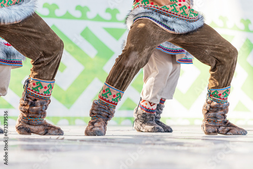Traditional warm shoes of the indigenous peoples of the north. Boots richly decorated with deer fur and national patterns