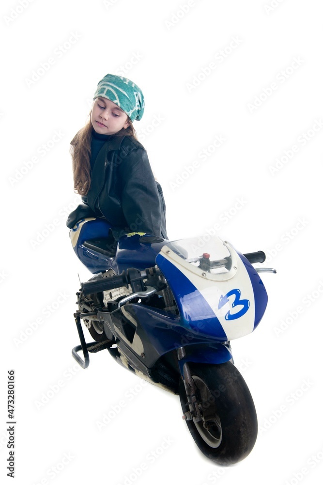 Young rider leaning on his blue racing motorcycle number three Young rider leaning on his blue racing motorcycle number three