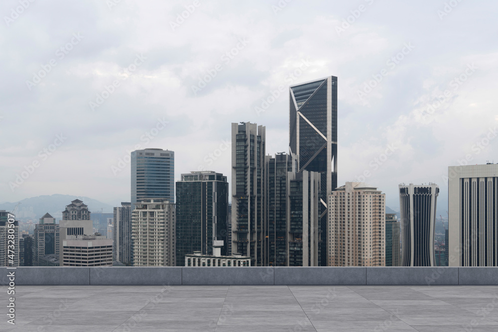 Fototapeta premium Panoramic Kuala Lumpur skyline view, concrete observatory deck on rooftop, daytime. Asian corporate and residential lifestyle. Financial city downtown, real estate. Product display mockup empty roof