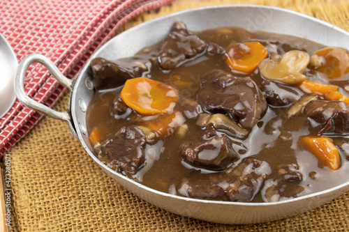 French dish " beef bourguignon " on a table