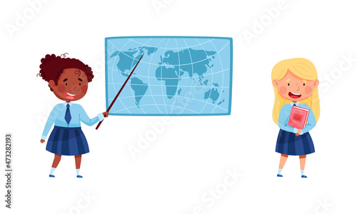 Cute elementary school students in uniform. Cheerful girls studying geography at lesson cartoon vector illustration
