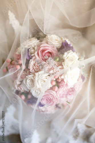 bouquet of light pink and white roses, decorated with pink hypericum