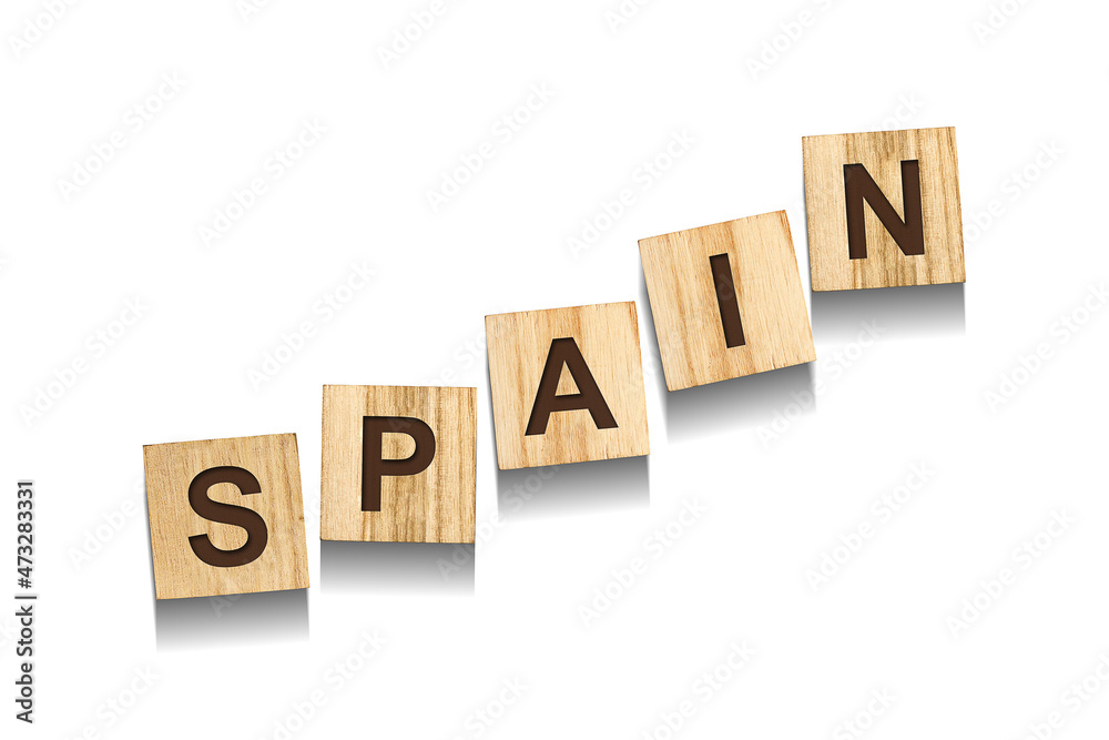 Spain, word on wooden blocks. Isolated on a white background. Spain, word on wooden blocks. Isolated on a white background.