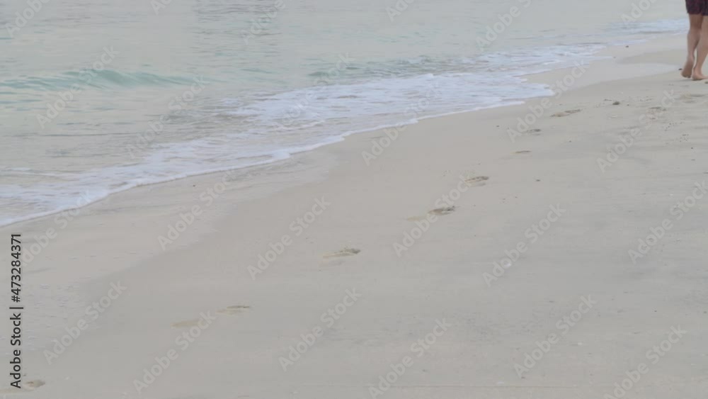 view of moving legs along the shore, close-up view of moving legs along the shore, close-up