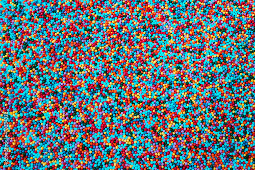 Colorful sweet background with colorful sprinkles.