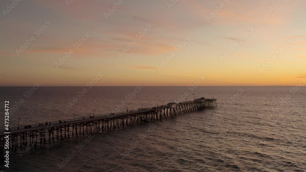 Pier on the Pacific Ocean with Breathtaking Sunset with Copy Space - Aerial Pier on the Pacific Ocean with Breathtaking Sunset with Copy Space - Aerial