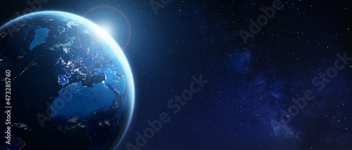 Earth viewed from space for global business, technology, finance, worldwide communications, internet concepts. Wide panoramic background for banner. World with city light in Europe. Elements from NASA photo