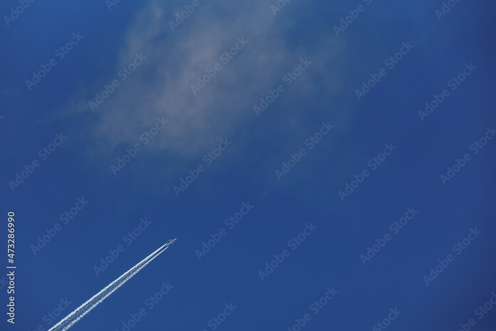 airplane footprints on a blue sky background airplane footprints on a blue sky background