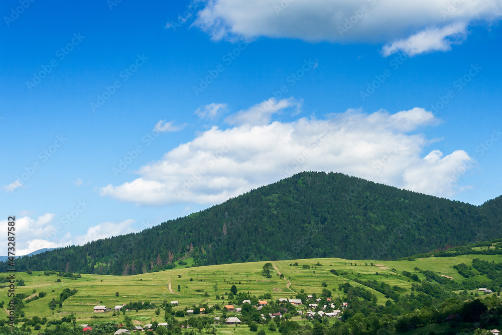 countryside landscape in summer. nature scenery in mountains. beautiful view of green rural environment with grassy meadows and hills countryside landscape in summer. nature scenery in mountains. beautiful view of green rural environment with grassy meadows and hills