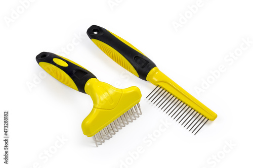 Two different plastic combs for pets with round metal teeth