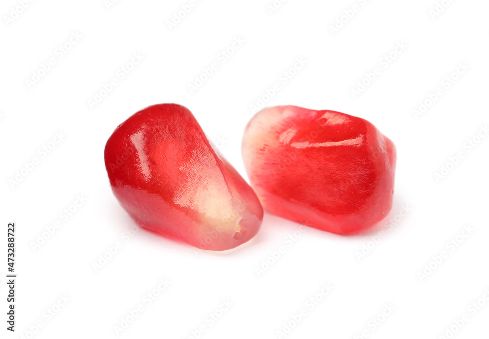 Juicy red pomegranate seeds on white background Juicy red pomegranate seeds on white background
