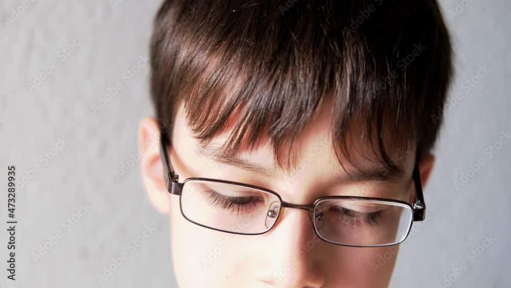 close-up face of young man, boy 10 years old, part of face, wearing glasses, concept of a happy childhood, diagnosis, treatment of ophthalmic diseases, eyelids, emotional development of children close-up face of young man, boy 10 years old, part of face, wearing glasses, concept of a happy childhood, diagnosis, treatment of ophthalmic diseases, eyelids, emotional development of children