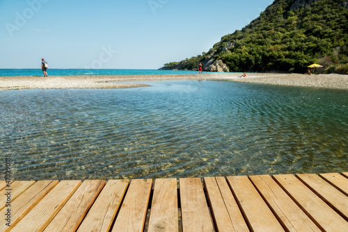View of the wood flooring and the beach on the Mediterranean coast. Turkey. © Ann Stryzhekin