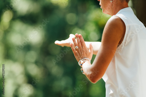 Woman Practicing Tai Chi Chuan Outdoors