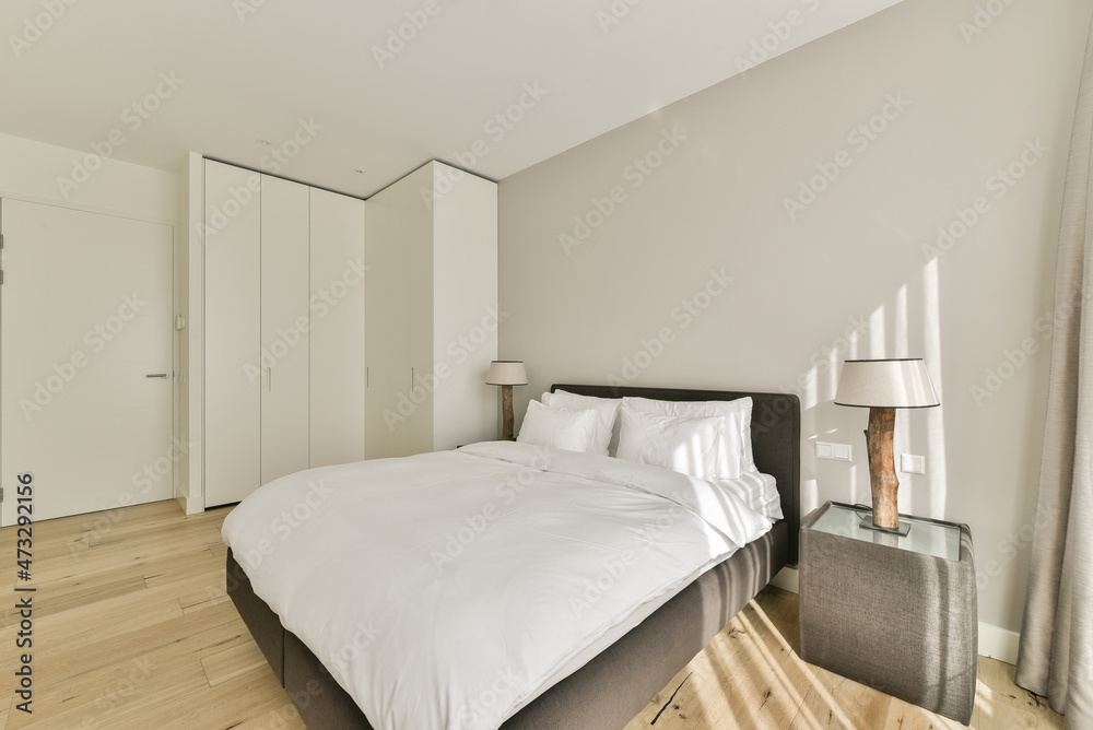 Minimalistic interior of bedroom in sunlight Minimalistic interior of bedroom in sunlight