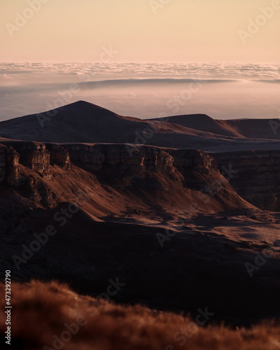 Fototapeta Naklejka Na Ścianę i Meble -  Photography of the canyon in the morning. Beautiful sunrise and nature. Mountains above the clouds. Russian nature.