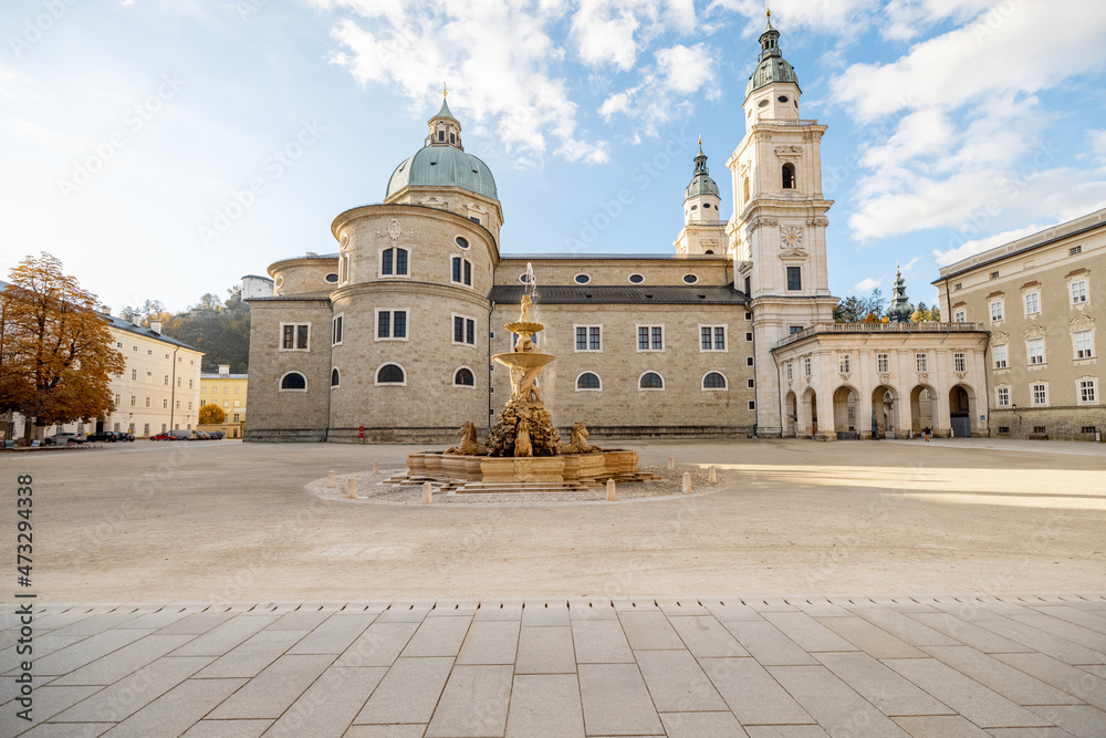 Morning view on Residence Square with famous cathedral on background in Salzburg city. Traveling Austria, visiting famous landmarks concept