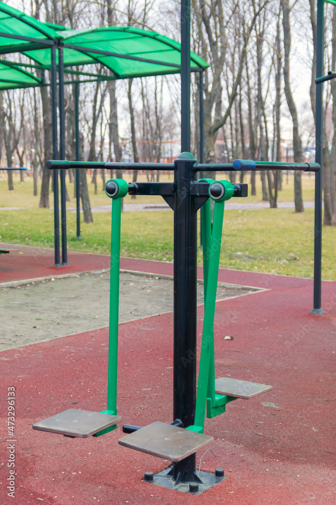 Sports ground with weight training equipment. Sports simulators in the fall.