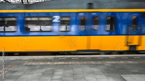 Canvas Print Blurred train moving fast in railway station