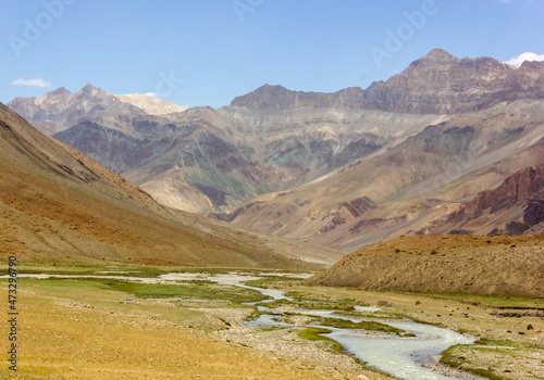 The Zanskar river flows through the high Himalayan mountains on a trekking route in Ladakh in north India. © Balaji