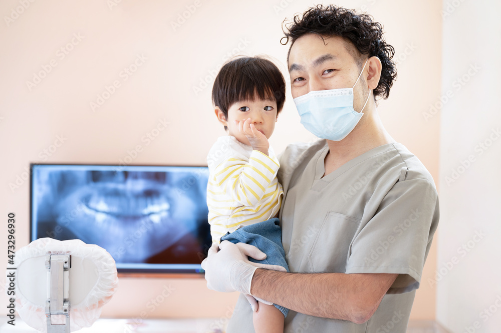 Image of a gentle pediatric dentist looking at the camera Image of a gentle pediatric dentist looking at the camera