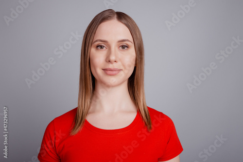 Photo of charming pretty sincere genuine lady look camera wear red t-shirt isolated on grey background
