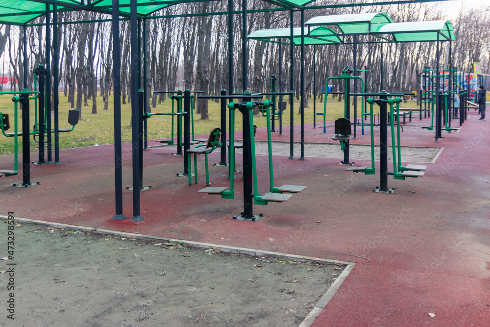 Outdoor sports ground with fitness equipment in a public outdoor park.