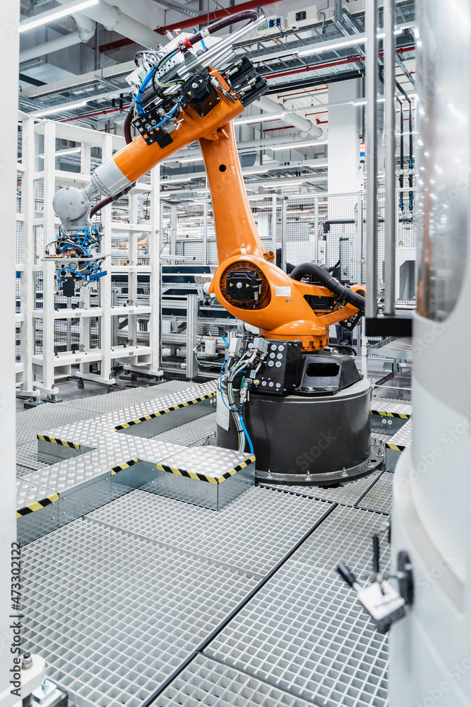 Automated robotic arm in manufacturing industry Stock Photo | Adobe Stock