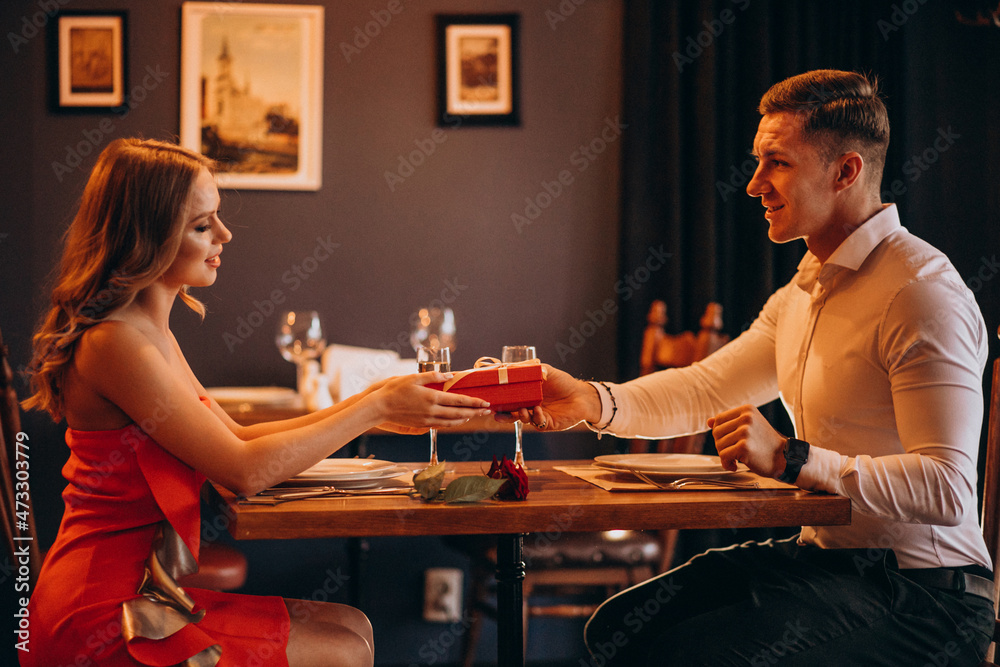 Couple having dinner at restaurant on valentines day Couple having dinner at restaurant on valentines day
