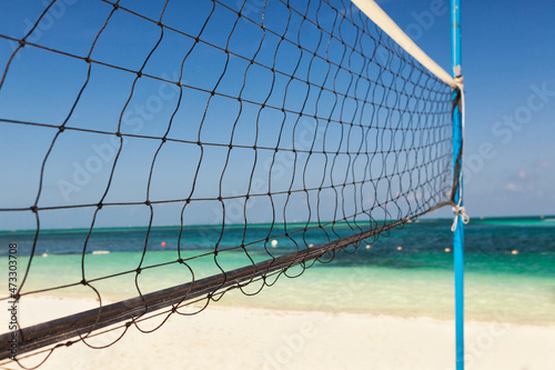 Volleyball net on a sandy beach photo