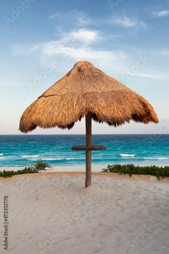 Palapa thatched shade on the  beach.  photo