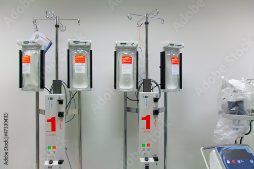 Infusers on drip stands in a modern hospital