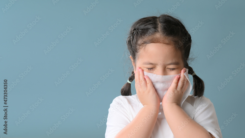 Little asian girl sick and sad with sneezing on nose and cold cough on tissue paper becauseweak or virus and bacteria from dust weather and kindergarten and kindergarten school for medical. Little asian girl sick and sad with sneezing on nose and cold cough on tissue paper becauseweak or virus and bacteria from dust weather and kindergarten and kindergarten school for medical.