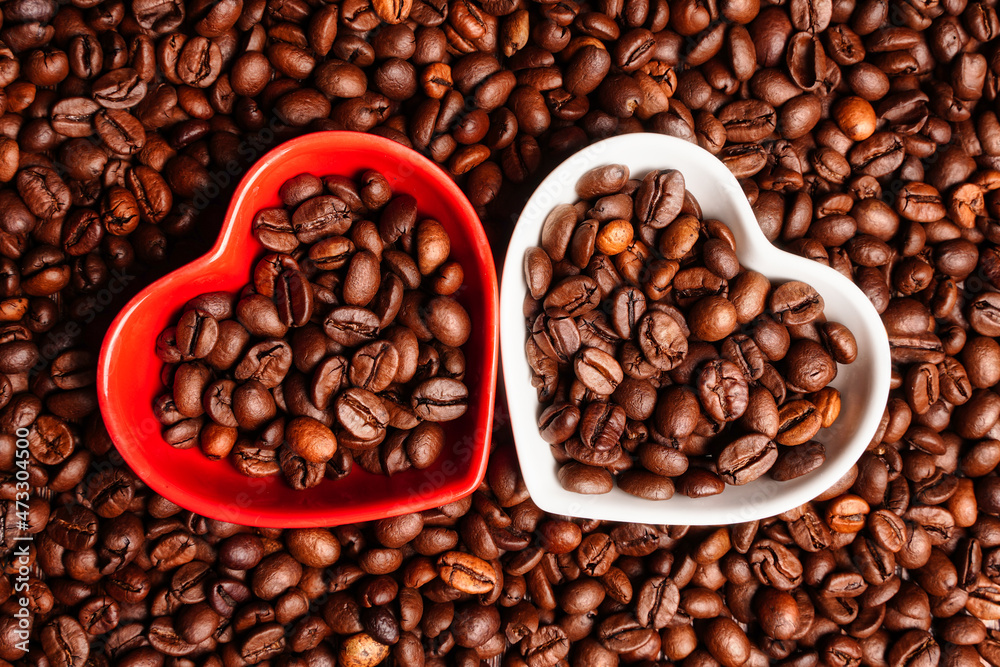 Fototapeta premium Two hearts full of coffee beans. Love symbol, greeting card for valentine's day. Good morning coffee drinker