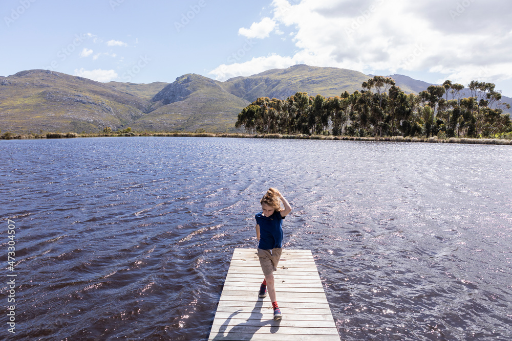 Children on boat launch at a farm property Children on boat launch at a farm property