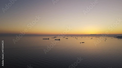 aerial shot in sea of marmara before sunset with cargo ships