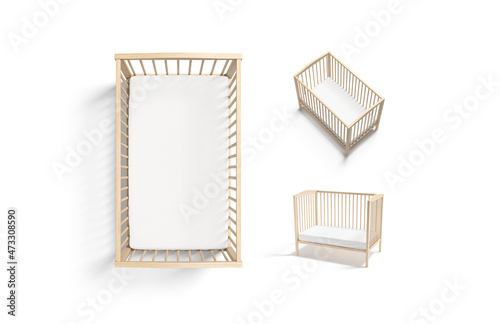 Blank wood cot with white crib sheet mockup, different views photo