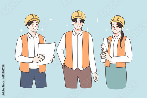 Construction industry and teamwork concept. Group of young smiling workers builders in helmets and uniform standing holding documents and blueprints vector illustration 